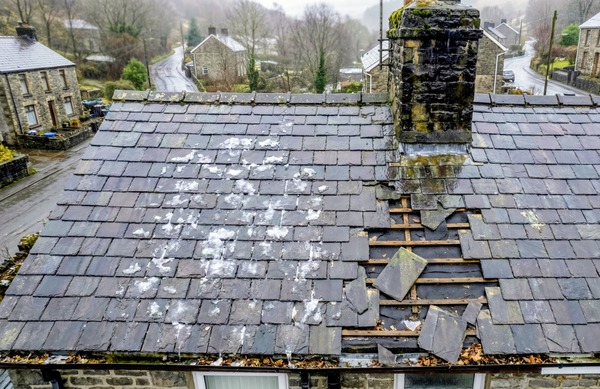 Drone view of residential roof inspection in South Wales showing detailed slate work